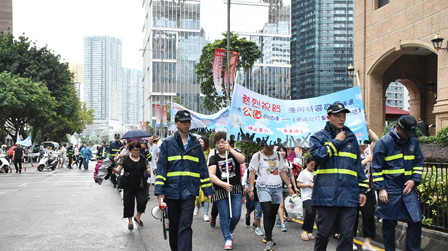 About 70 march in Macau to celebrate domestic violence law