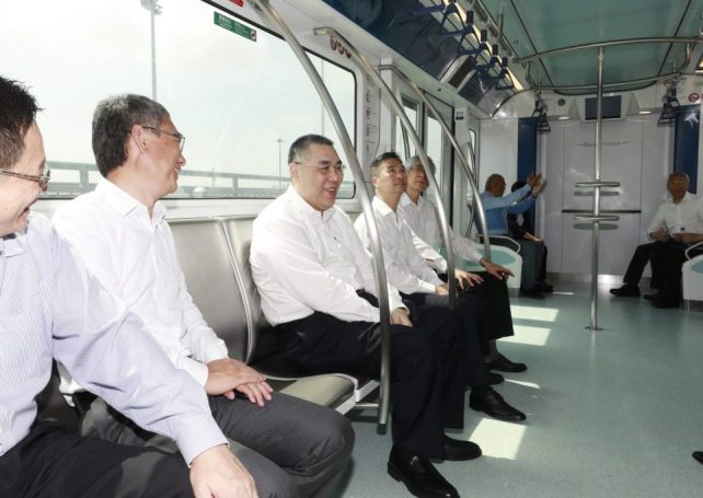 Chui Sai On and senior officials take their first LRT ride