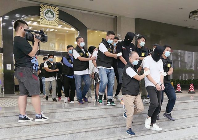9 men nabbed for cheating bank out of HK$900,000 for bogus car loans