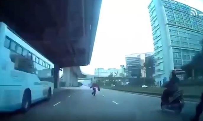 Boy runs out into road near airport, hit by scooter