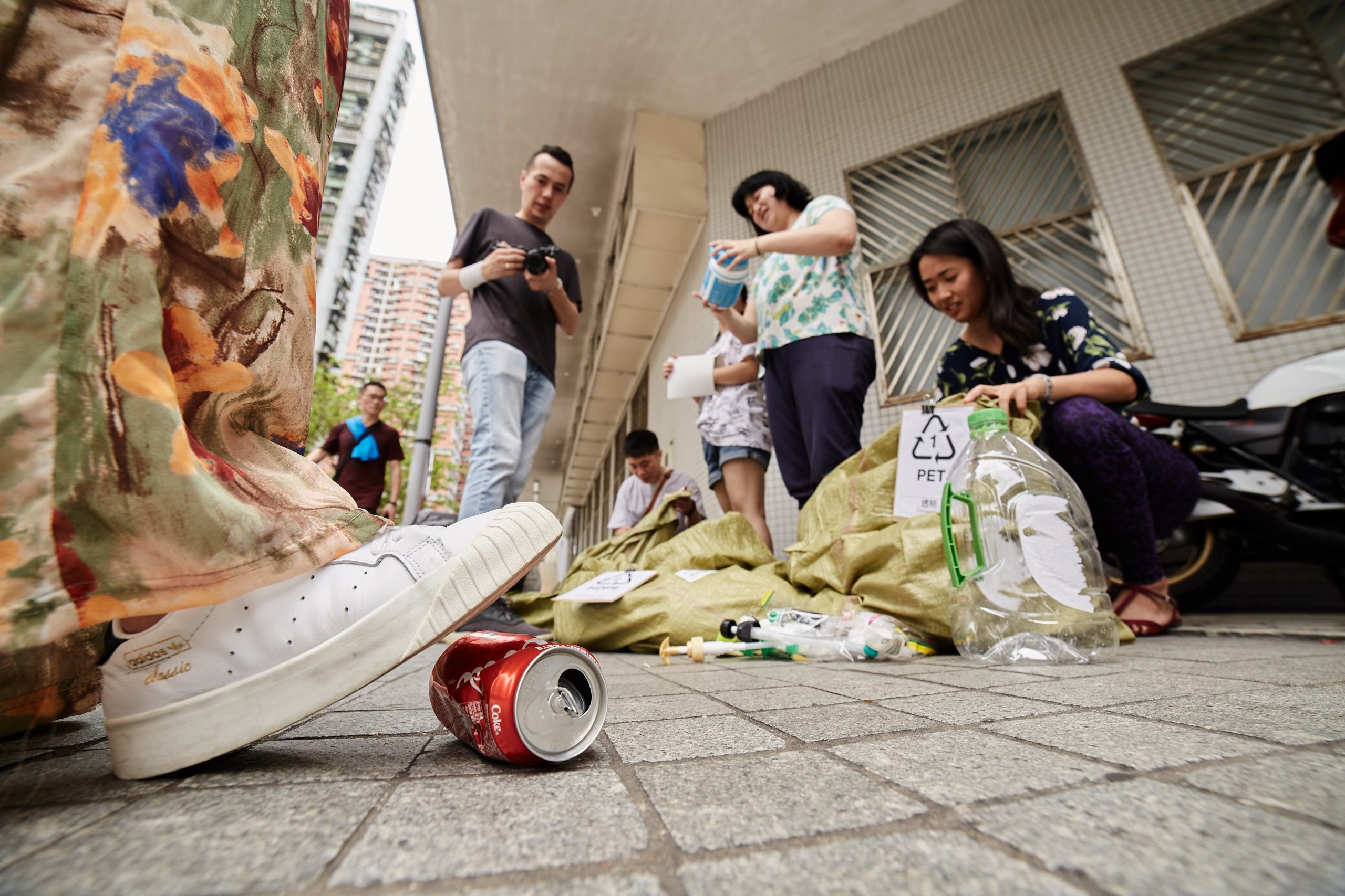 A can is about to be crushed underfoot at a recycling campaign event hosted by Macau for Waste Reduction | Photo by António Sanmarful