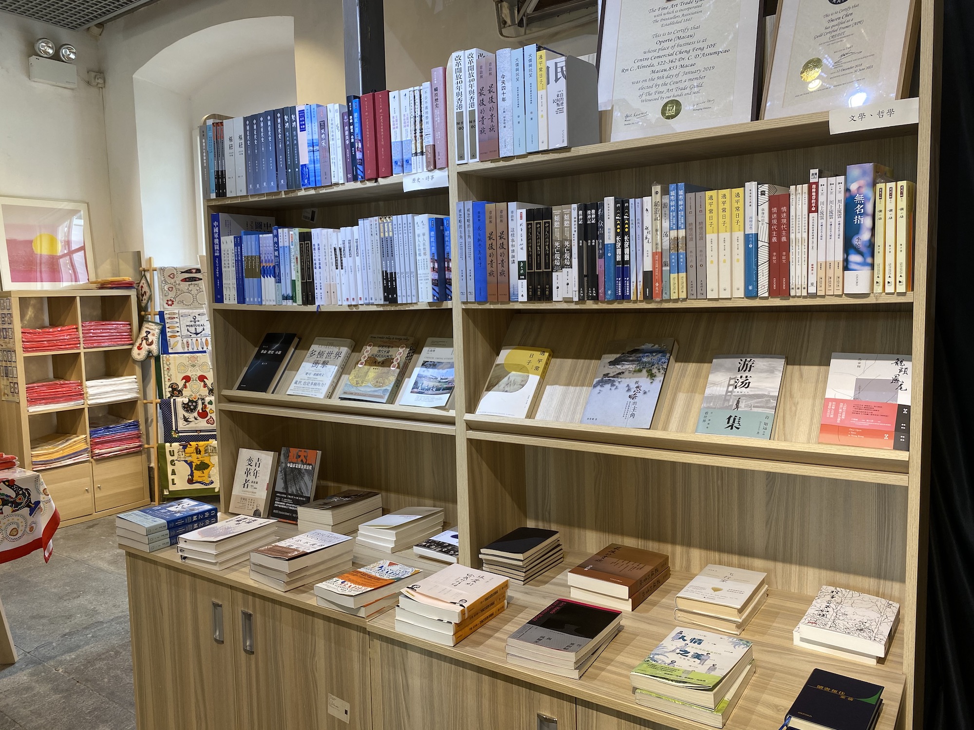 Books on shelves inside Universal Gallery & Bookstore