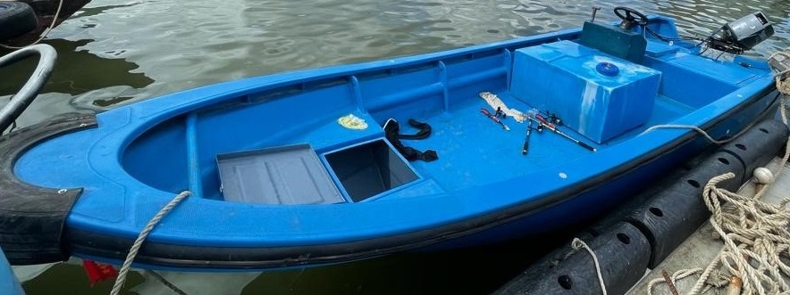 blue fibreglass speedboat