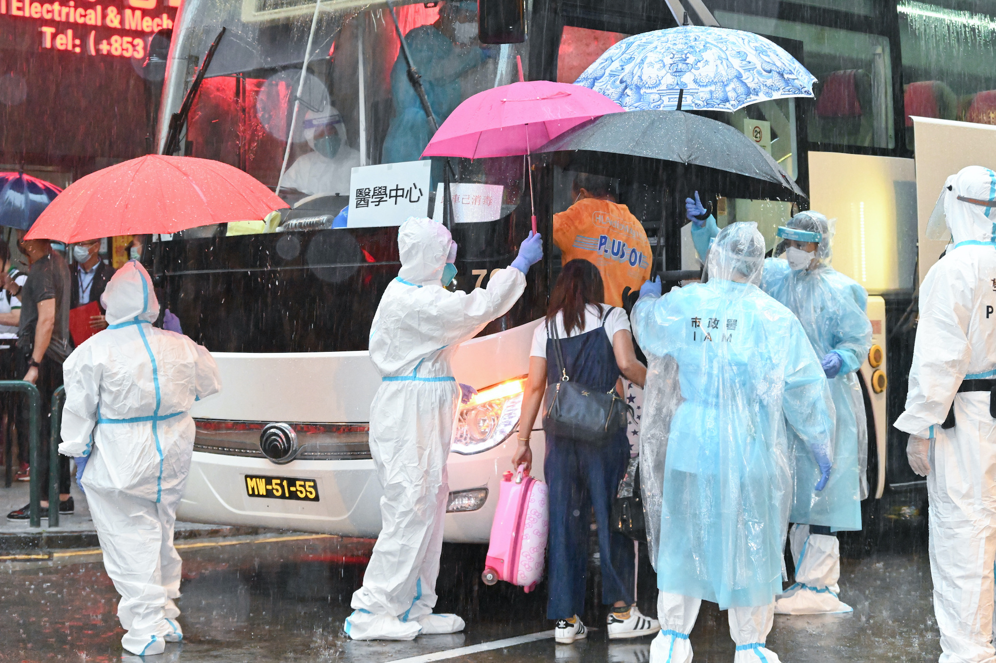Macau health workers move residents