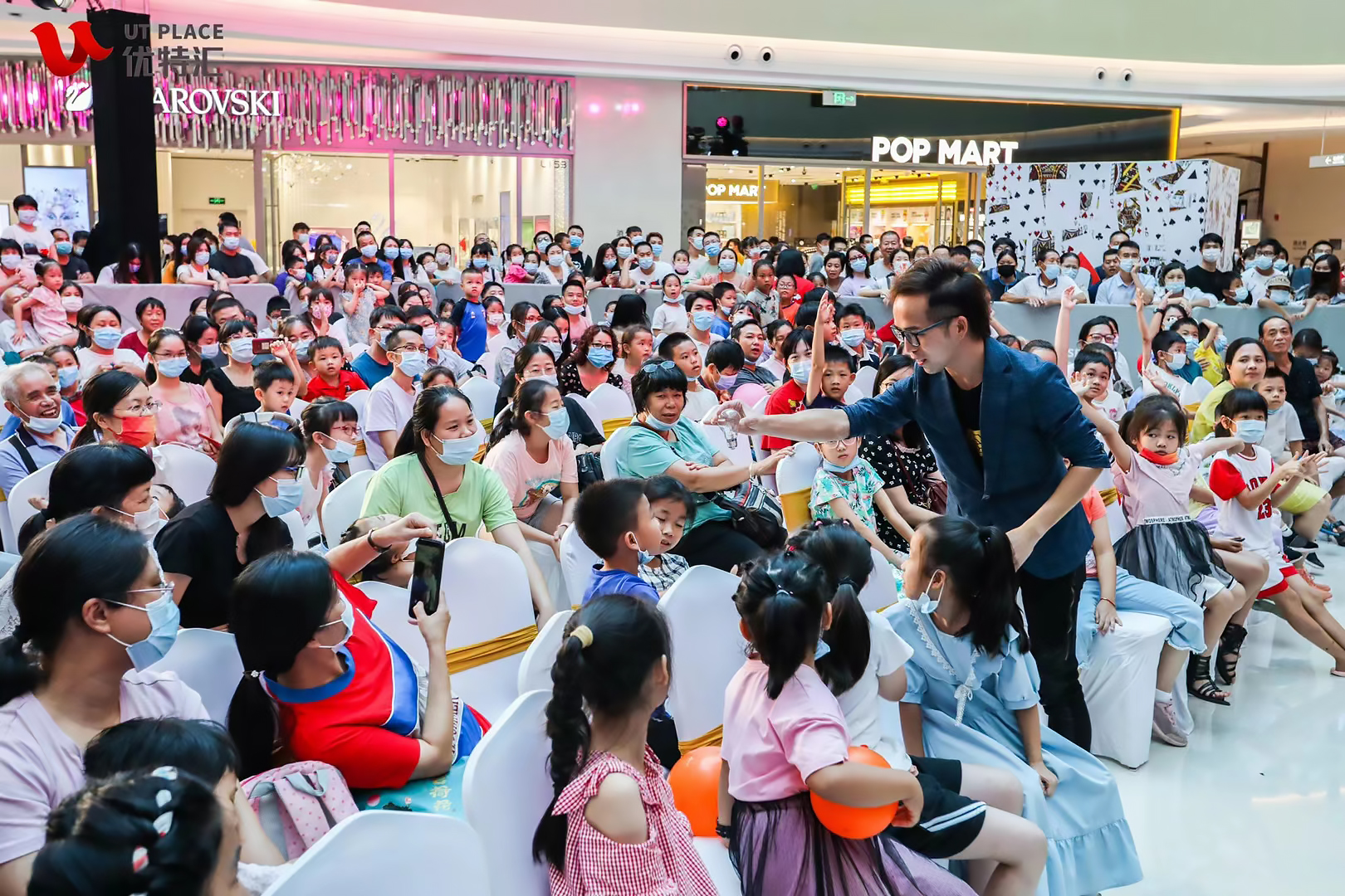 Victor Choi performing at a new mall opening