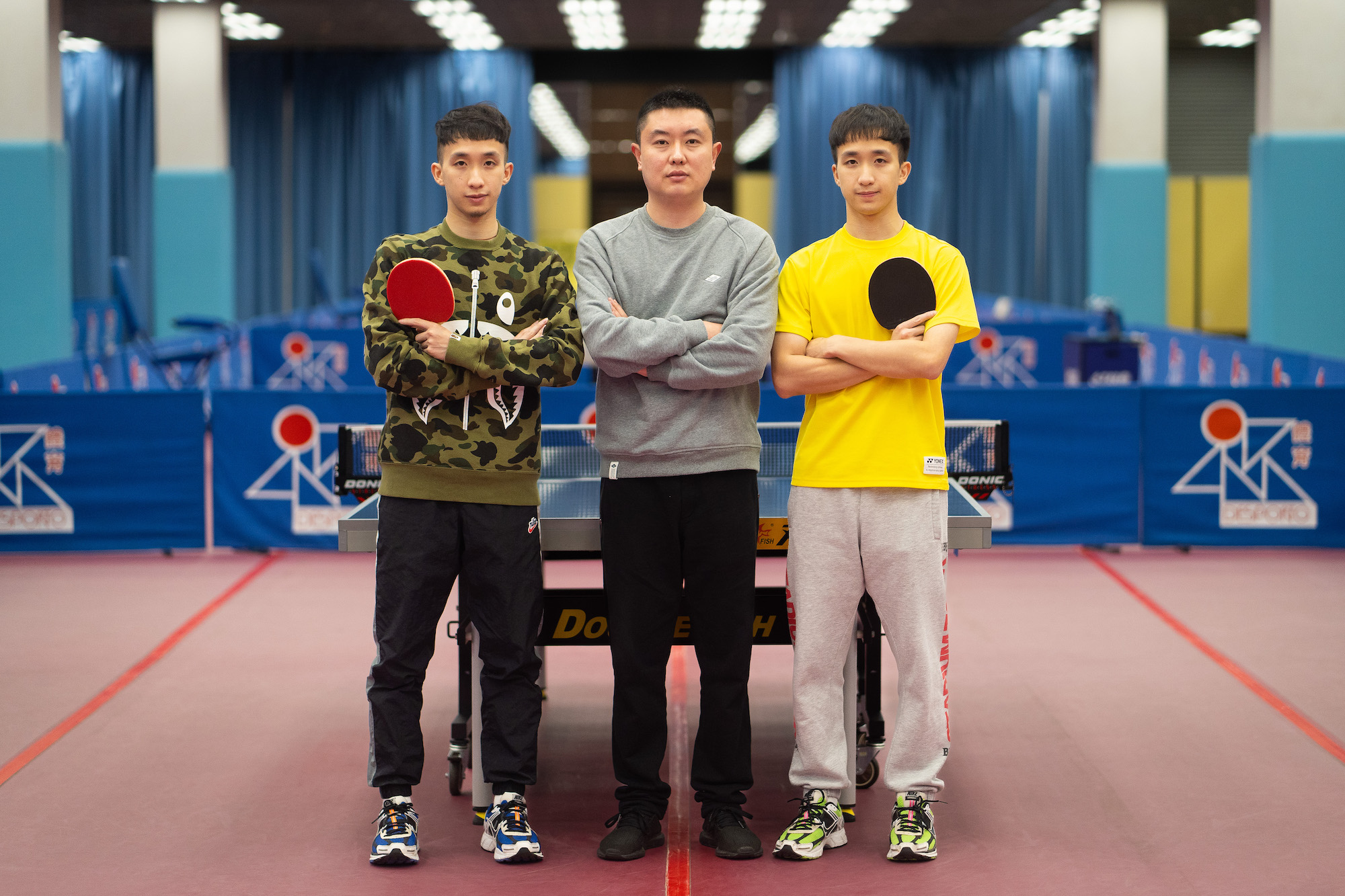 Cheong Chi Chun and Cheong Chi Cheng with their coach