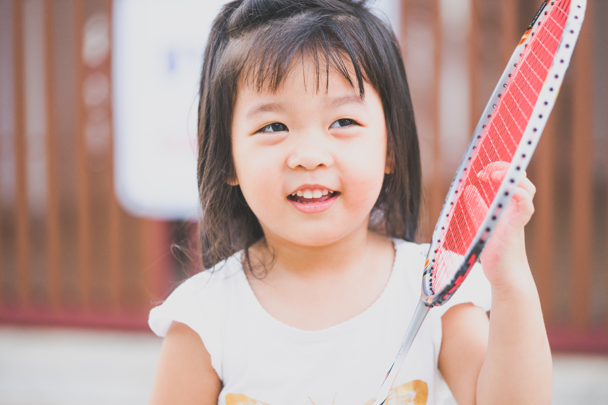 A girl playing badminton
