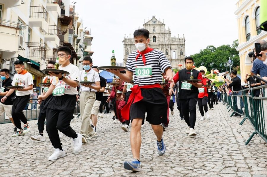 Runners compete in traditional Tray Race for World Tourism Day