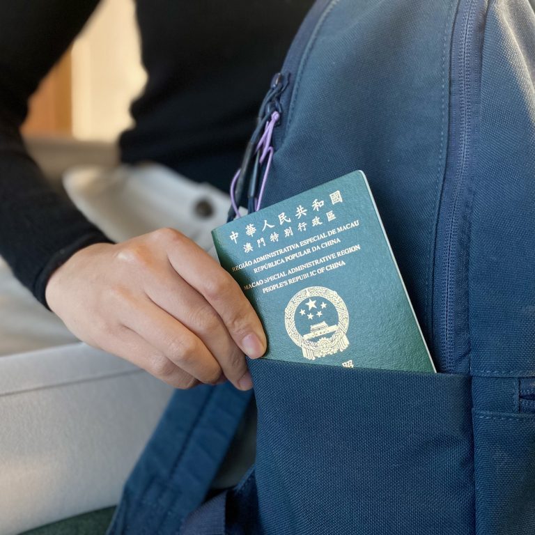 Macao passport in a backpack