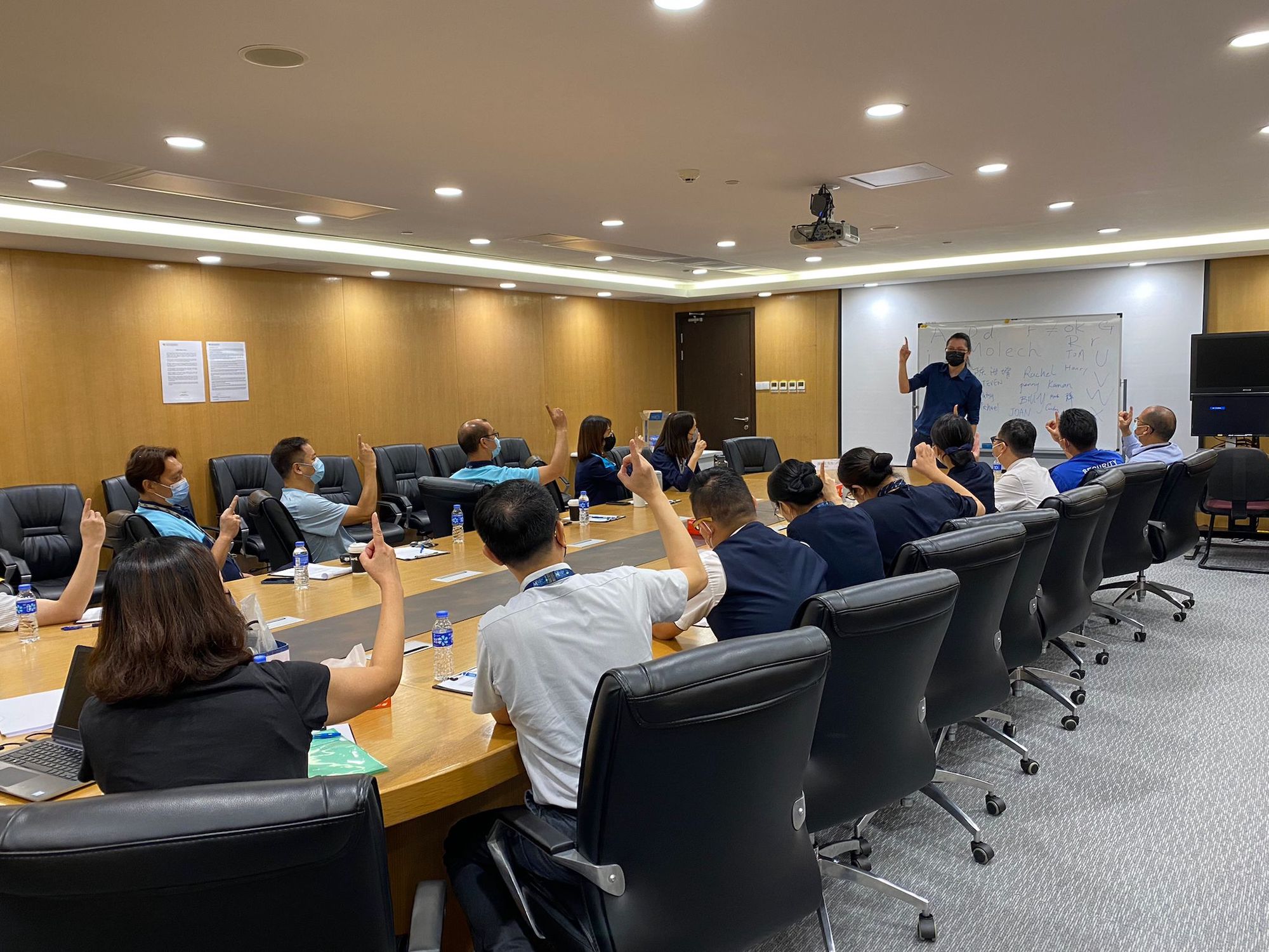 An MDA staff member conducts a sign language class