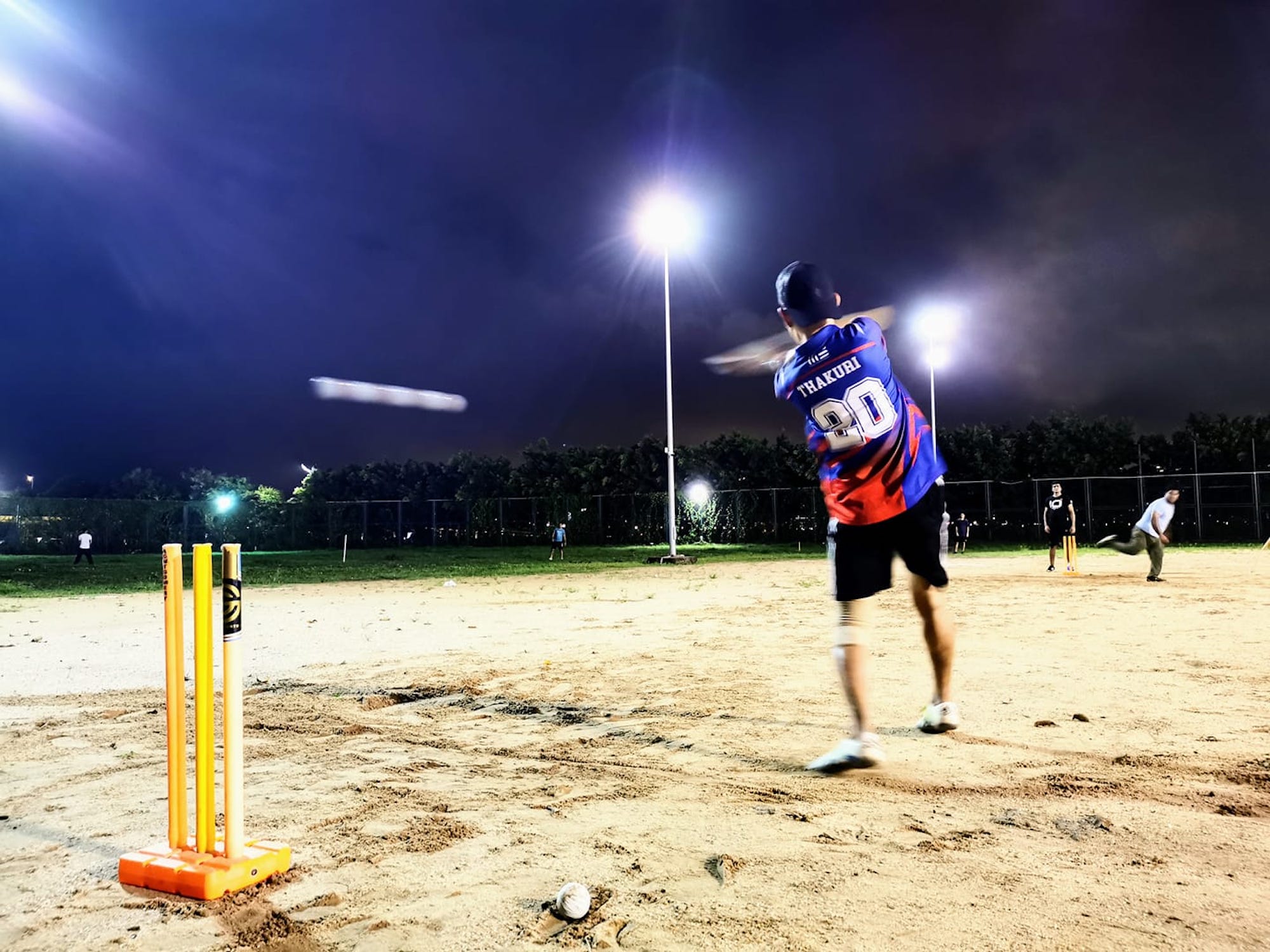 The MCA’s weekly Friday night cricket, held at a bleak sandy expanse next to the Macau Tower