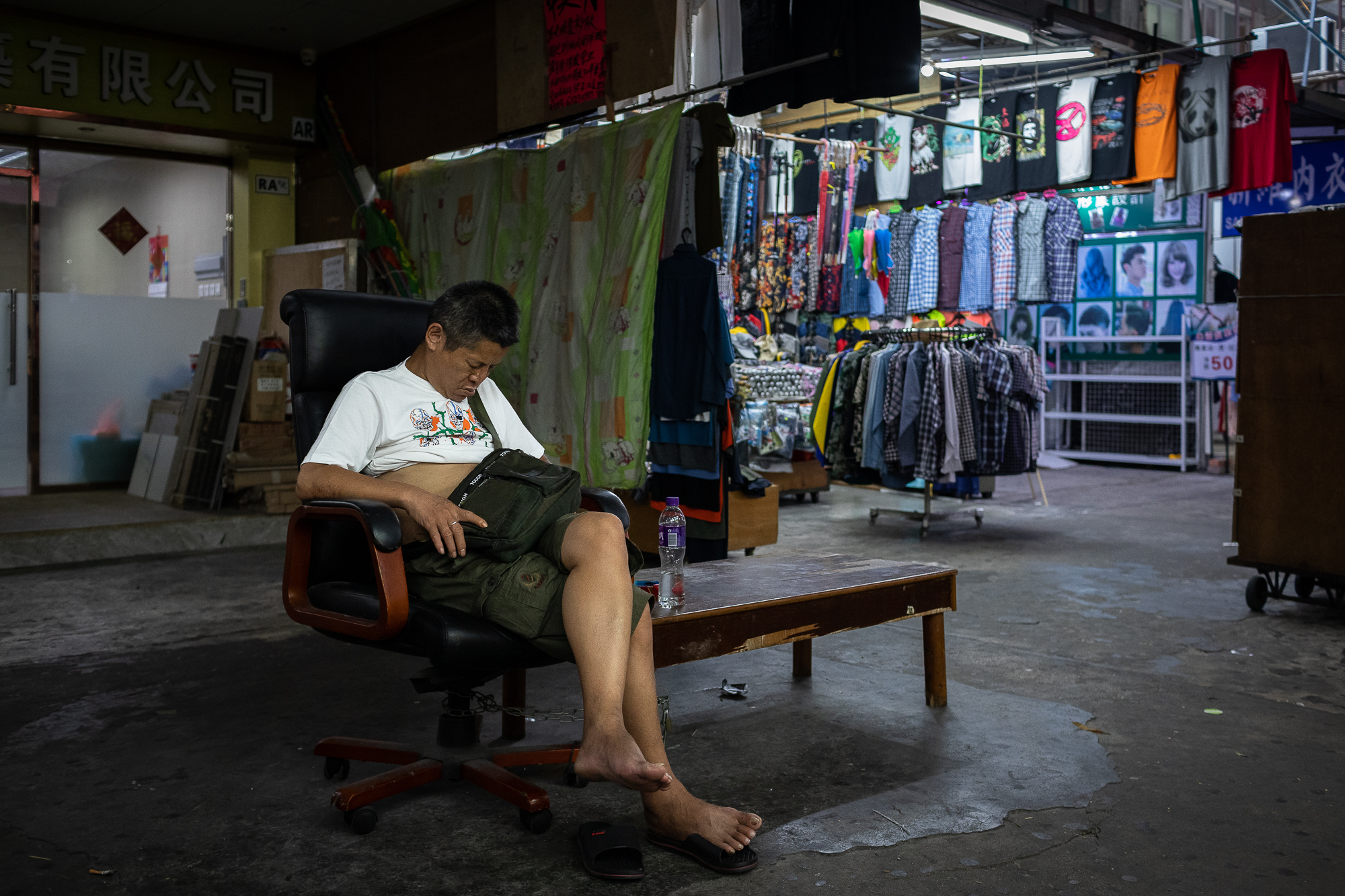 A discarded office chair makes the perfect napping spot for this man at the market in the Iao Hon neighborhood of northern Macao