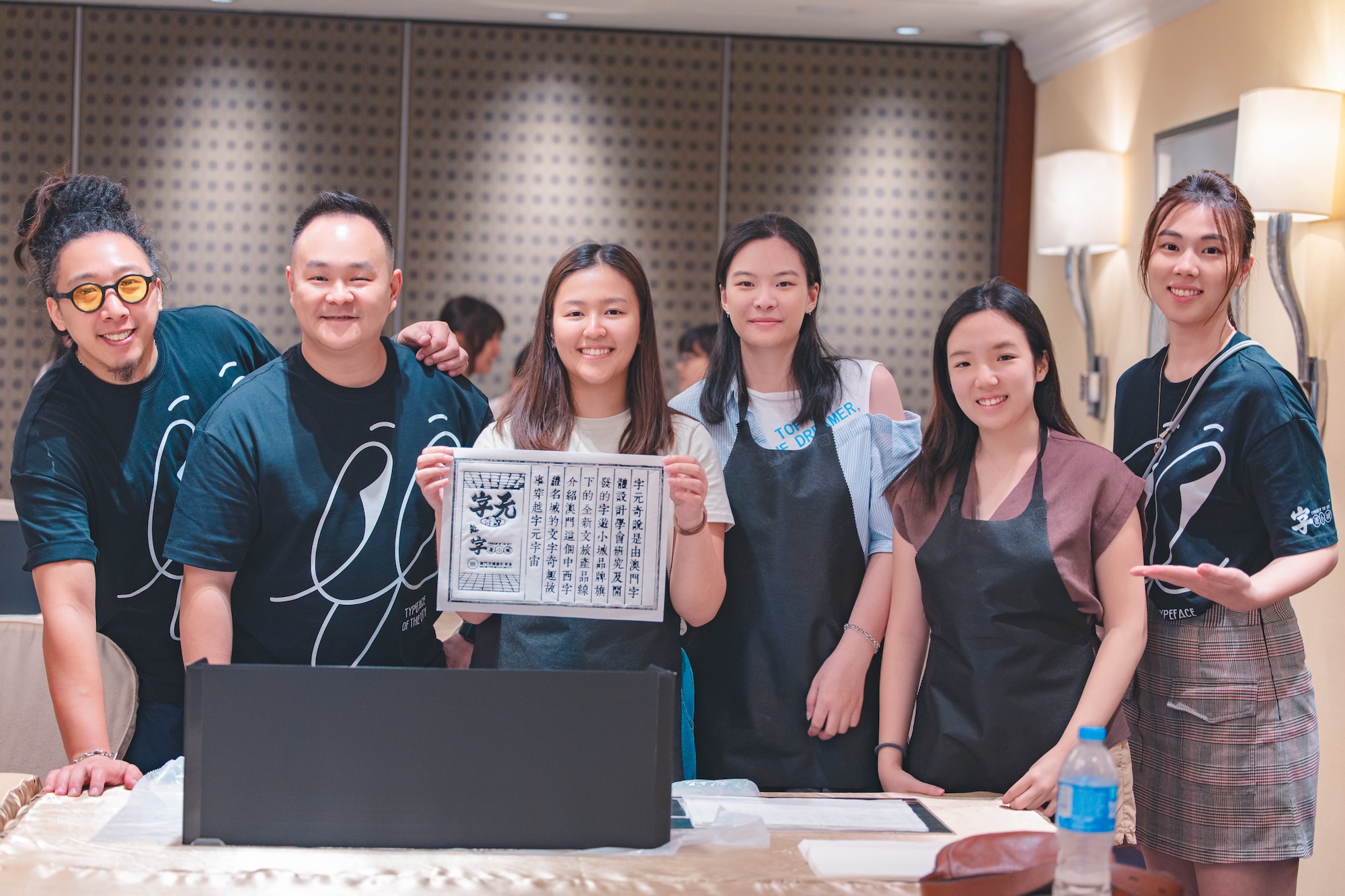 Silva, Tang and workshop participants engage in the ancient art of woodblock printing