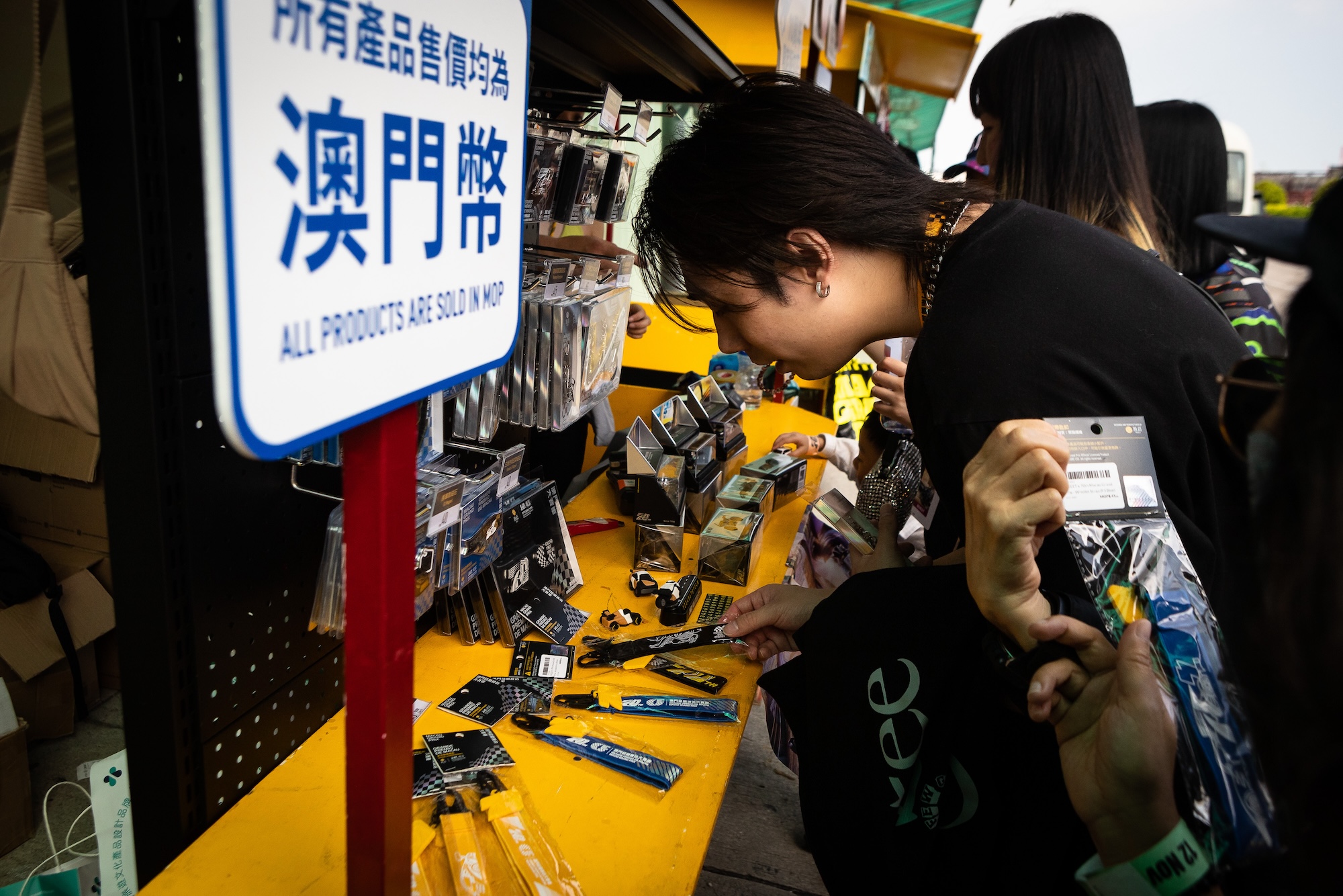 A member of the public looks at souvenirs offered for sale