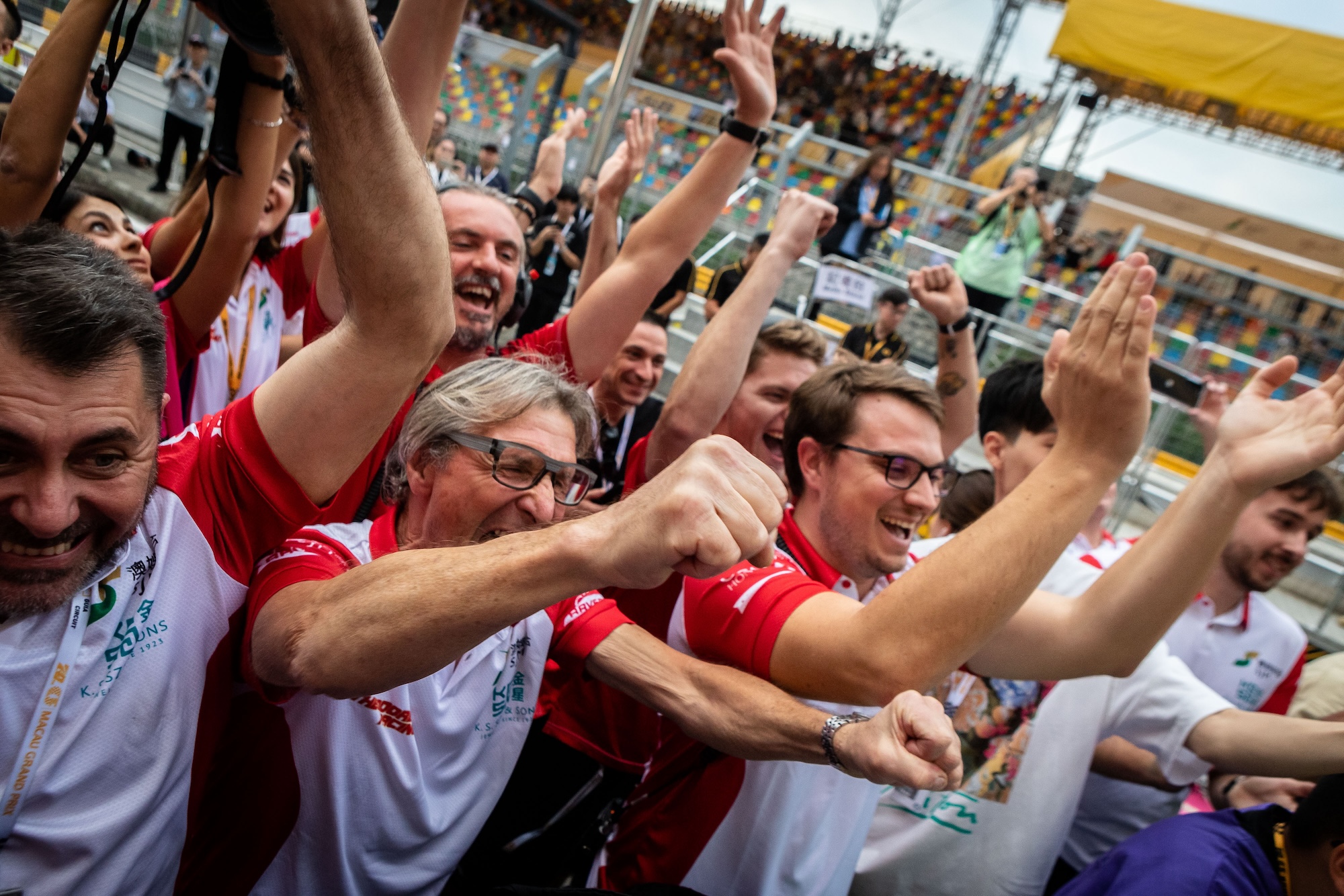 Members of SJM Theodore Prema Racing team celebrate the victory of their driver Arvid Lindblad in the Formula 4 Race on November 12, 2023