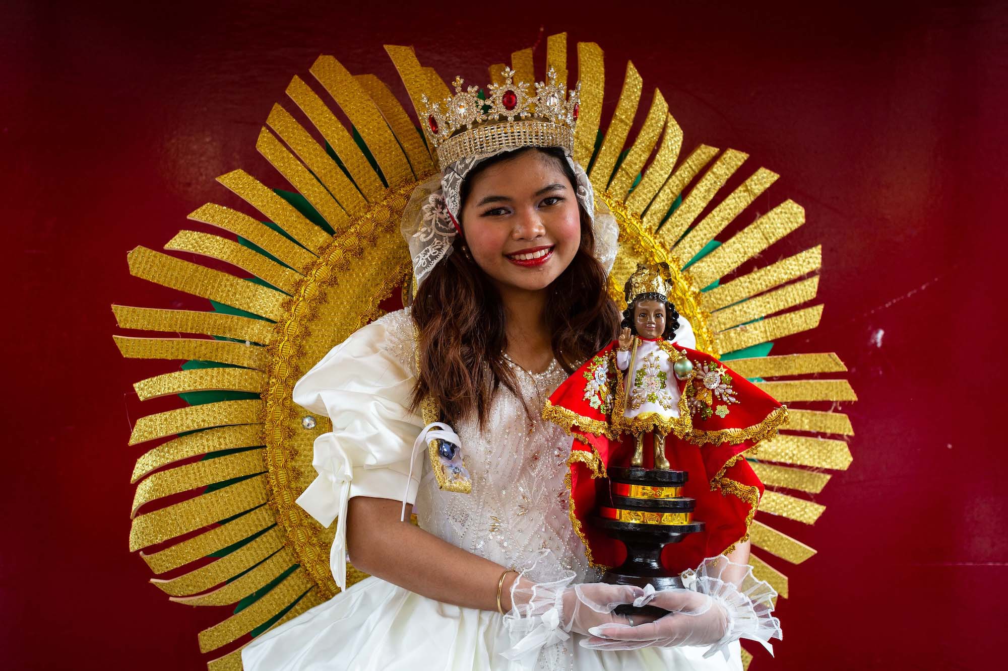 The queen of the Debutantes of Macau dance troupe poses for a portrait before the start of the Sinulog procession
