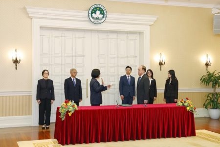 Chief Executive Ho Iat Seng administers an oath to the president of the Electoral Affairs Commission for the Chief Executive Election, Song Man Lei, on 8 April at the Government Headquarters