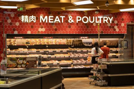 Shoppers browse the meat cabinet at a supermarket in Ningbo, China, on 2 August 2023 - Photo by Tada Images