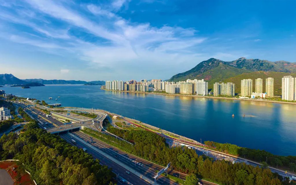Smooth blue water ringed by dramatic hills: a view of Tolo Harbour from the Hyatt Regency Sha Tin