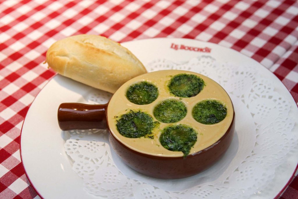 At Le Bouchon, diners can try French classics, such as escargot laden in garlic butter and chopped parsley