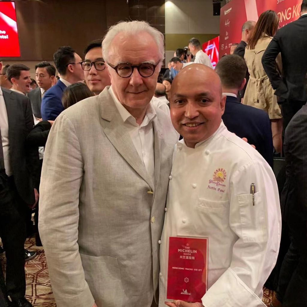 Paul pictured with 21-Michelin-star chef Alain Ducasse when Paul received a Michelin star for Golden Peacock in 2013