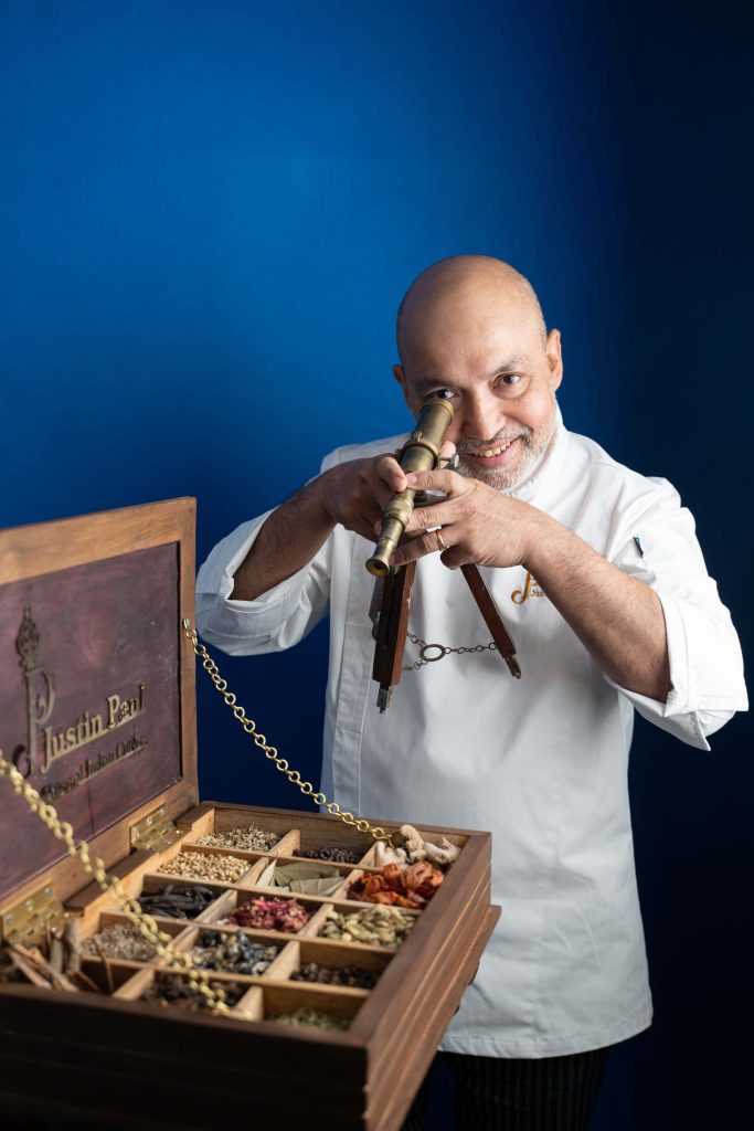 Paul hamming it up for the camera with a display of some of the Indian spices used at Justindia