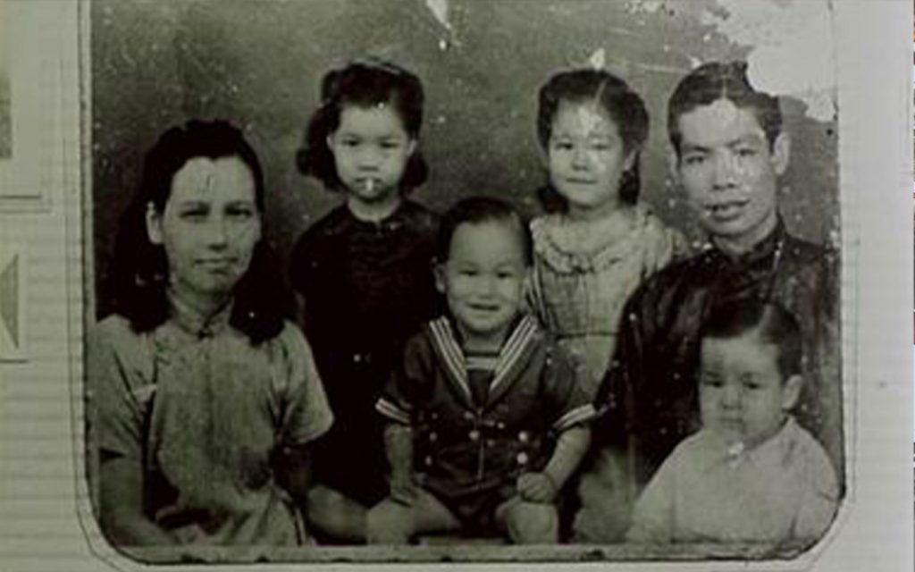 A family portrait, taken circa 1941, when Lee would have roughly been a year old. His mother Grace was Eurasian