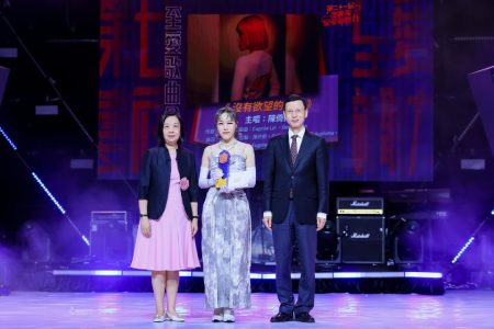 Elisa Chan receives one of four awards at the Best of Pop ceremony held on 19 July