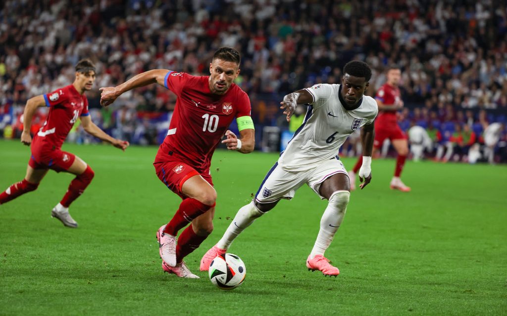 Marc Guéhi (right) pictured defending against Serbia’s Dušan Tadić on 16 June 2024