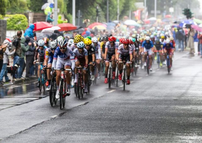 A Tour de France cyclist has been fined for kissing his wife