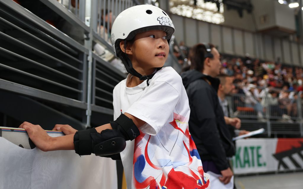 China's Zheng Haohao watches her teammate Li Yujuan's run during the women's park preliminaries of skateboarding at the Olympic Qualifier Series Shanghai in east China's Shanghai on 16 May 2024