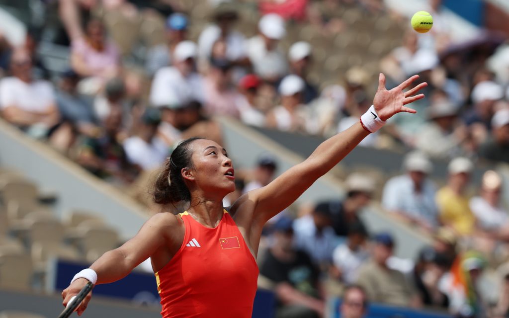 Zheng Qinwen serves during the women's singles quarter-final match against Germany's Angelique Kerber at the Paris 2024 Olympic Games on 31 July 2024