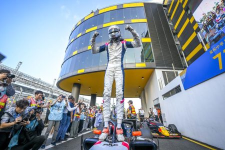 Ugo Ugochukwu celebrating on top of his car after winning the Formula Regional event at the 2024 Macau Grand Prix