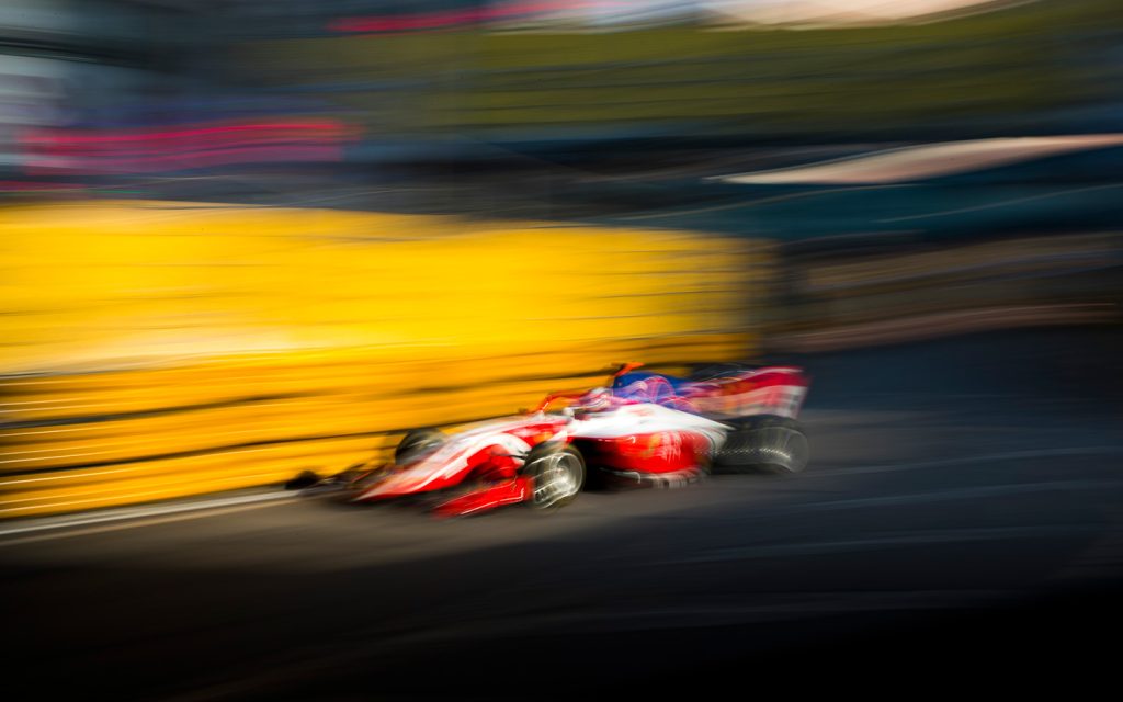 The distinctive red and white livery of an SJM Theodore Prema Racing car