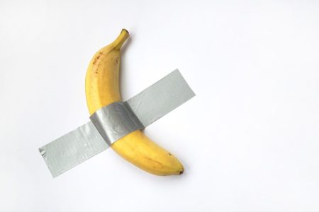 A banana duct-taped to the wall has sold for more than US$5 million at Sotheby’s