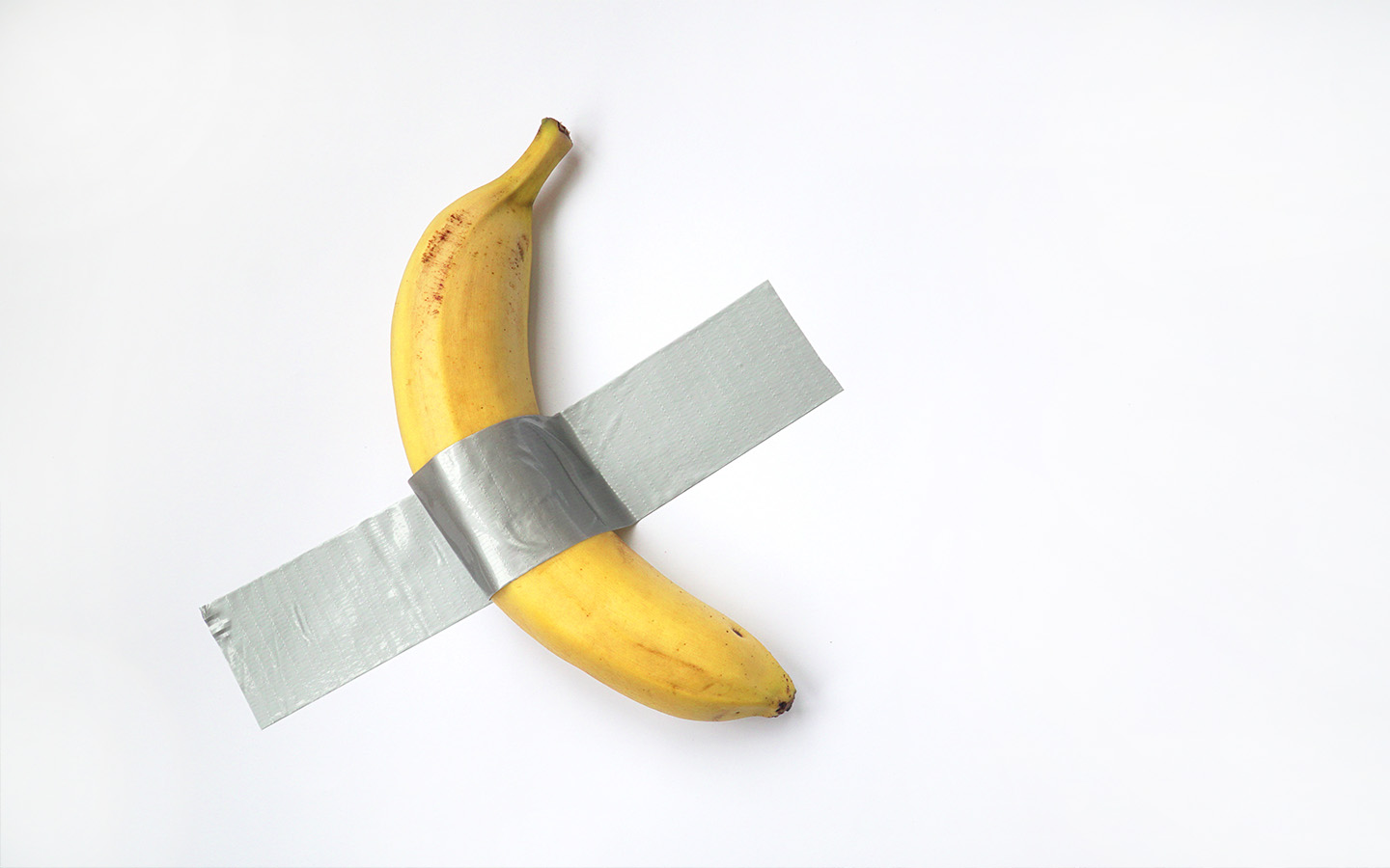 A banana duct-taped to the wall has sold for more than US$5 million at Sotheby’s