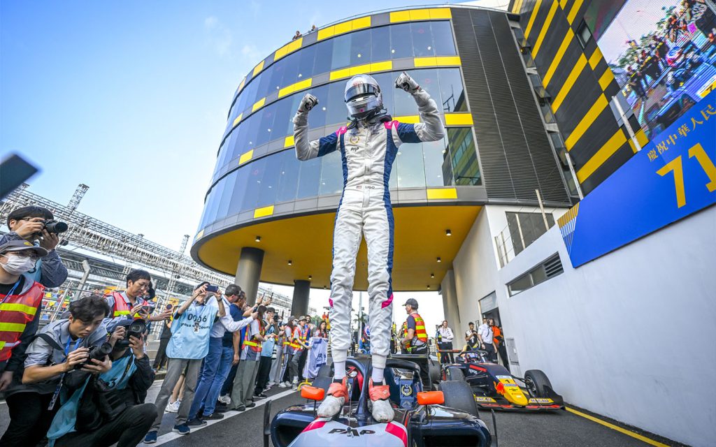 Ugo Ugochukwu leaps on top of his car after winning the inaugural Formula Regional event at the 2024 Macau Grand Prix - Macao features