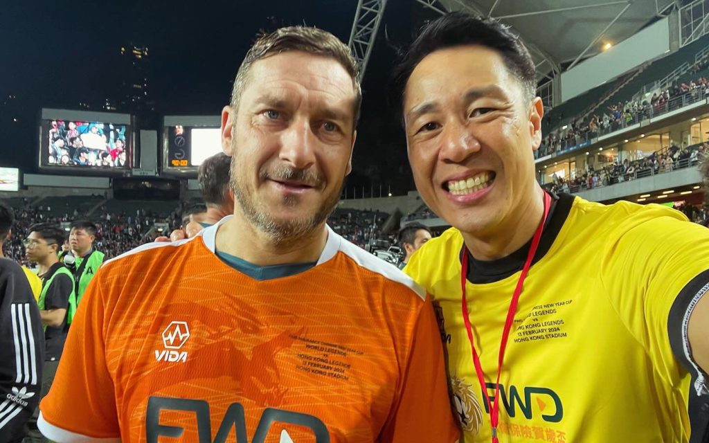 Kwok pictured with Roma and Italian legend Francesco Totti after a match against the World Legends in Hong Kong