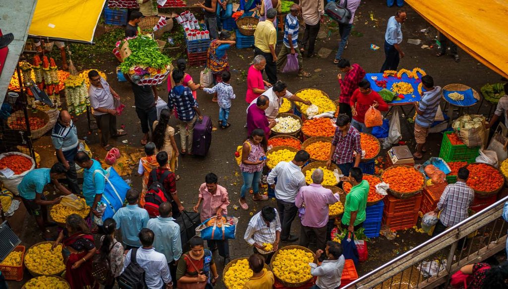 People at a flower market in the Indian city of Mumbai prepare to celebrate Diwali, which kicks off in October