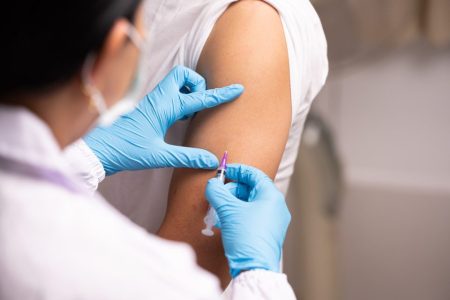 Health officials urge vaccinations as flu season reaches its peak