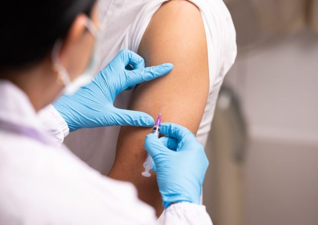 Health officials urge vaccinations as flu season reaches its peak