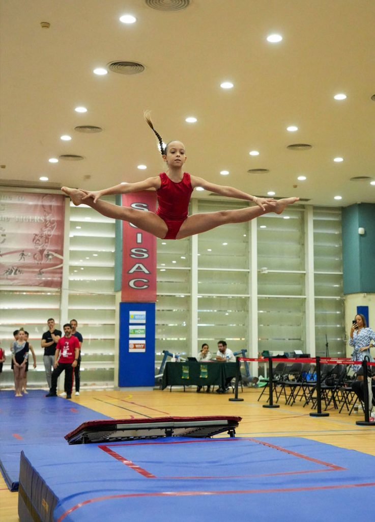 GCM gymnast performing a Stradle Jump at Macau Trampoline Gymnastics Championship 2024