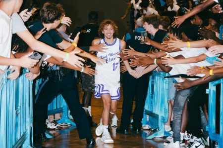 Noah Neumann engages with fans before getting on court and doing what he loves most