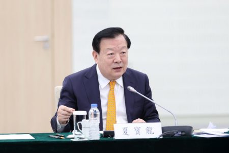 Xia Baolong appeals to Macao businesses to persevere amid economic headwinds