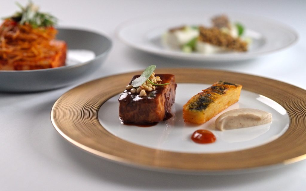 Chef Edward Lee’s “unctuous and decadent” Korean braised short ribs get brightened by kimchi juice and paired with ginseng pommes Anna