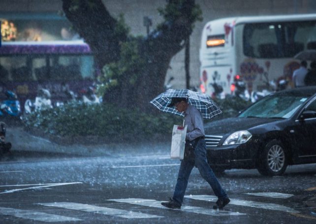 Some classes suspended as heavy rain lashes Macao