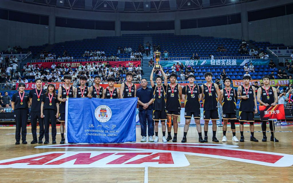 The University of Macau men’s basketball team poses with their trophy and medals after claiming their first national title at the CUBAL Finals