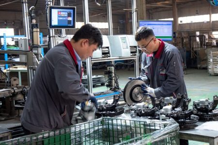 China’s manufacturing activity fell slightly last month, figures show