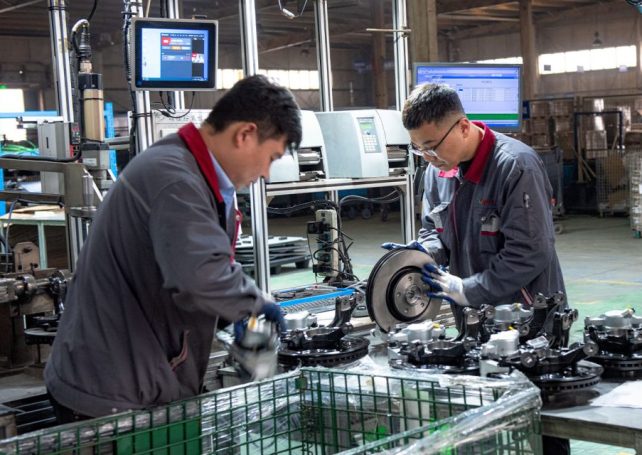 China’s manufacturing activity fell slightly last month, figures show