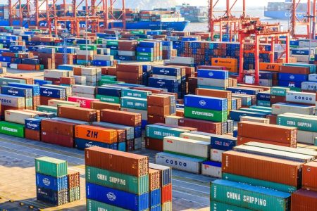 Containers await shipment at a cargo terminal at Shanghai's Yangshan Deepwater Port